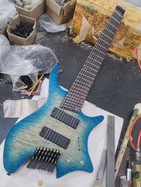 China 8string headless guitar ash body quilted maple top fanned fret supplier