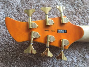 6 string bass guitar JP2 yellow quilted maple body back and front Active pickups Golden bridges and tuner Alder with ebo supplier