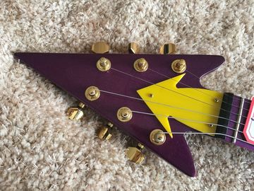 Custom guitar shop prince guitar Purple color boat anchor electric guitar with golden hardwares plastic pickguard supplier