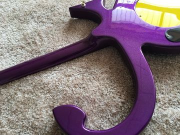 Custom guitar shop prince guitar Purple color boat anchor electric guitar with golden hardwares plastic pickguard supplier