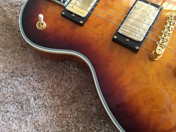 LP custom guitar tobacco sunburst quilted maple body Back contour and neck joint contour Ebony fingerboard custom guitar supplier