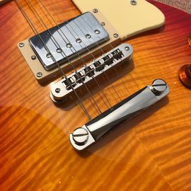 One piece Neck one piece body electric guitar, Upgrade Tune-o-Matic bridge guitar Tiger Flame standard guitar in sunburs supplier