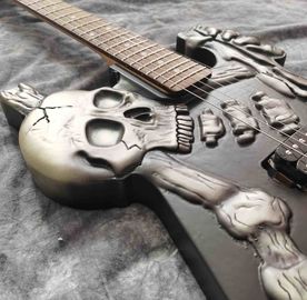 Skull Carving Body 6 Strings Electric Guitar in Matte Black Color supplier