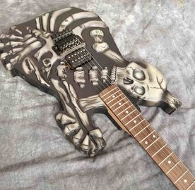 Skull Carving Body 6 Strings Electric Guitar in Matte Black Color supplier