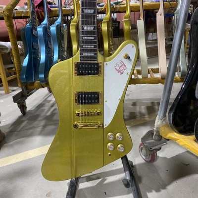 Custom Grand Firebird Style Electric Guitar in Golden Color with Gold Hardware Mahogany Body Rosewood Fingerboard supplier